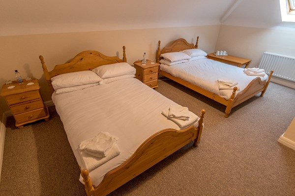 An image labelled Twin Ensuite Room
